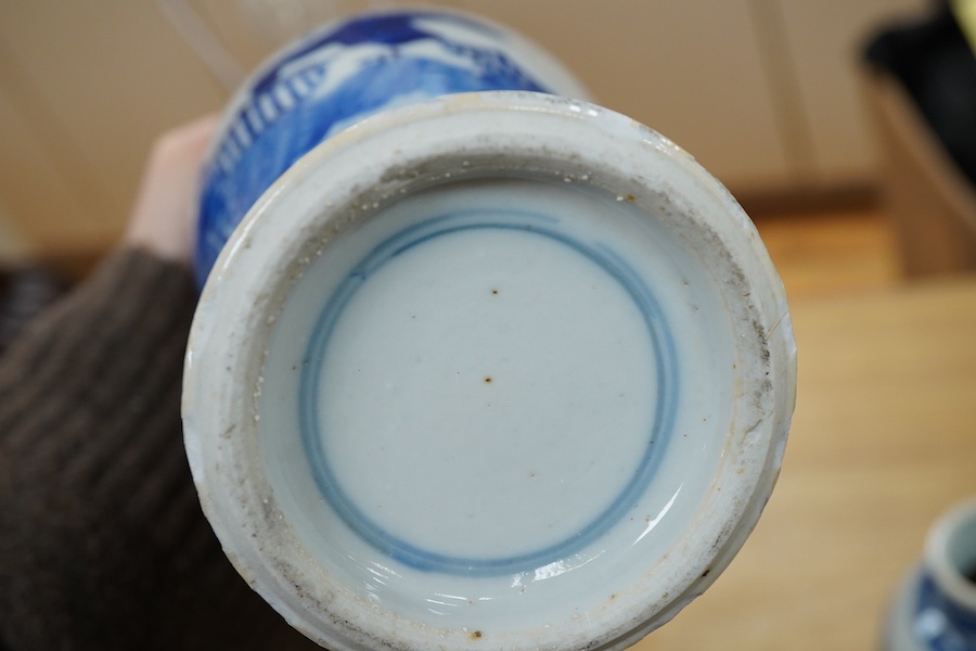 A pair of Chinese blue and white vases and a baluster jar and cover, largest 23cm high